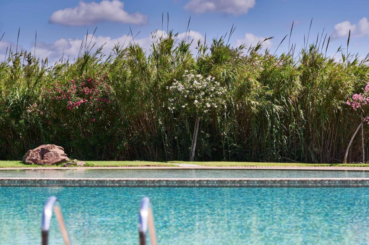 Baia Di Chia Resort Sardinia, Curio Collection By Hilton Exterior photo
