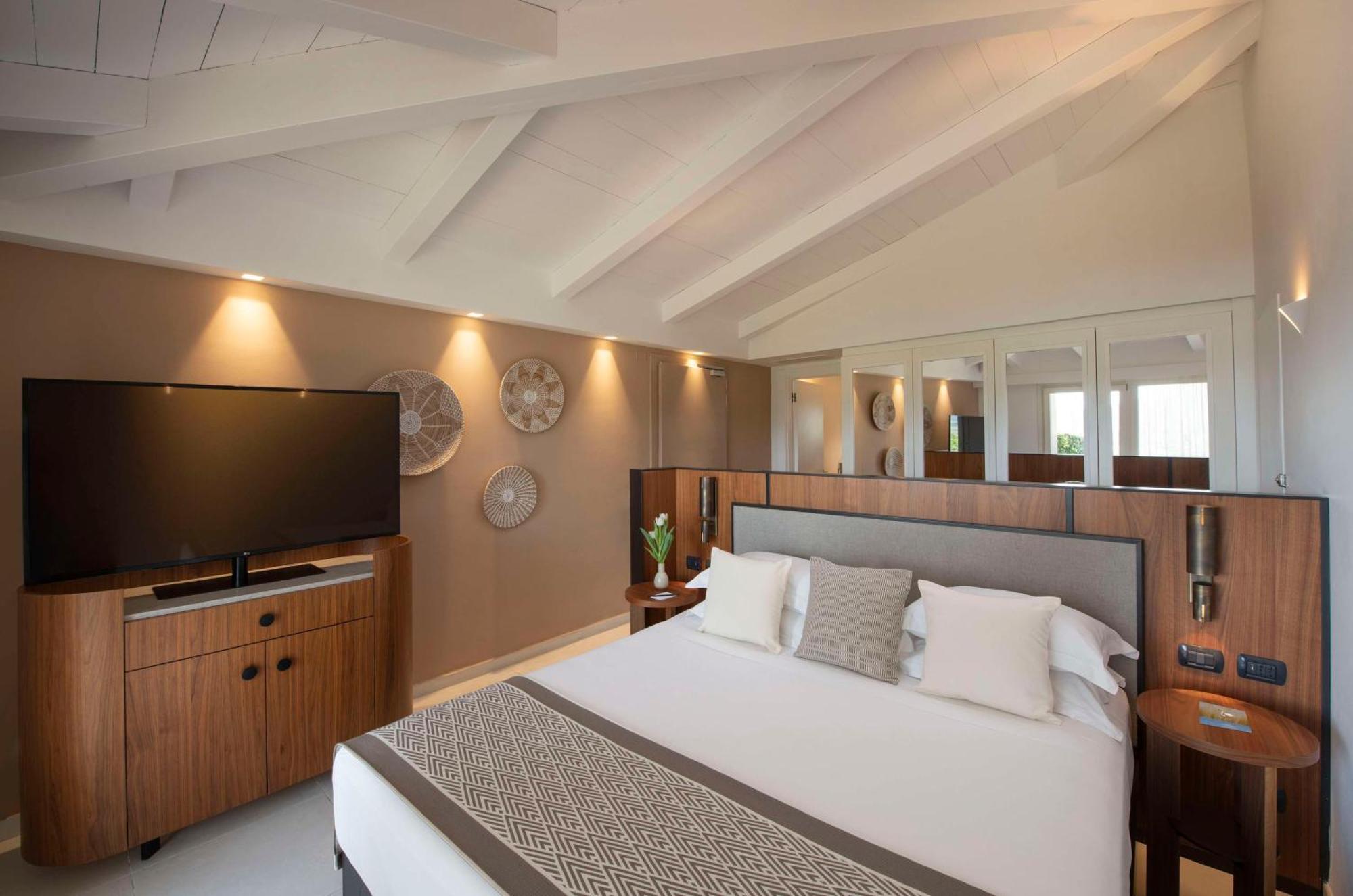 Baia Di Chia Resort Sardinia, Curio Collection By Hilton Exterior photo