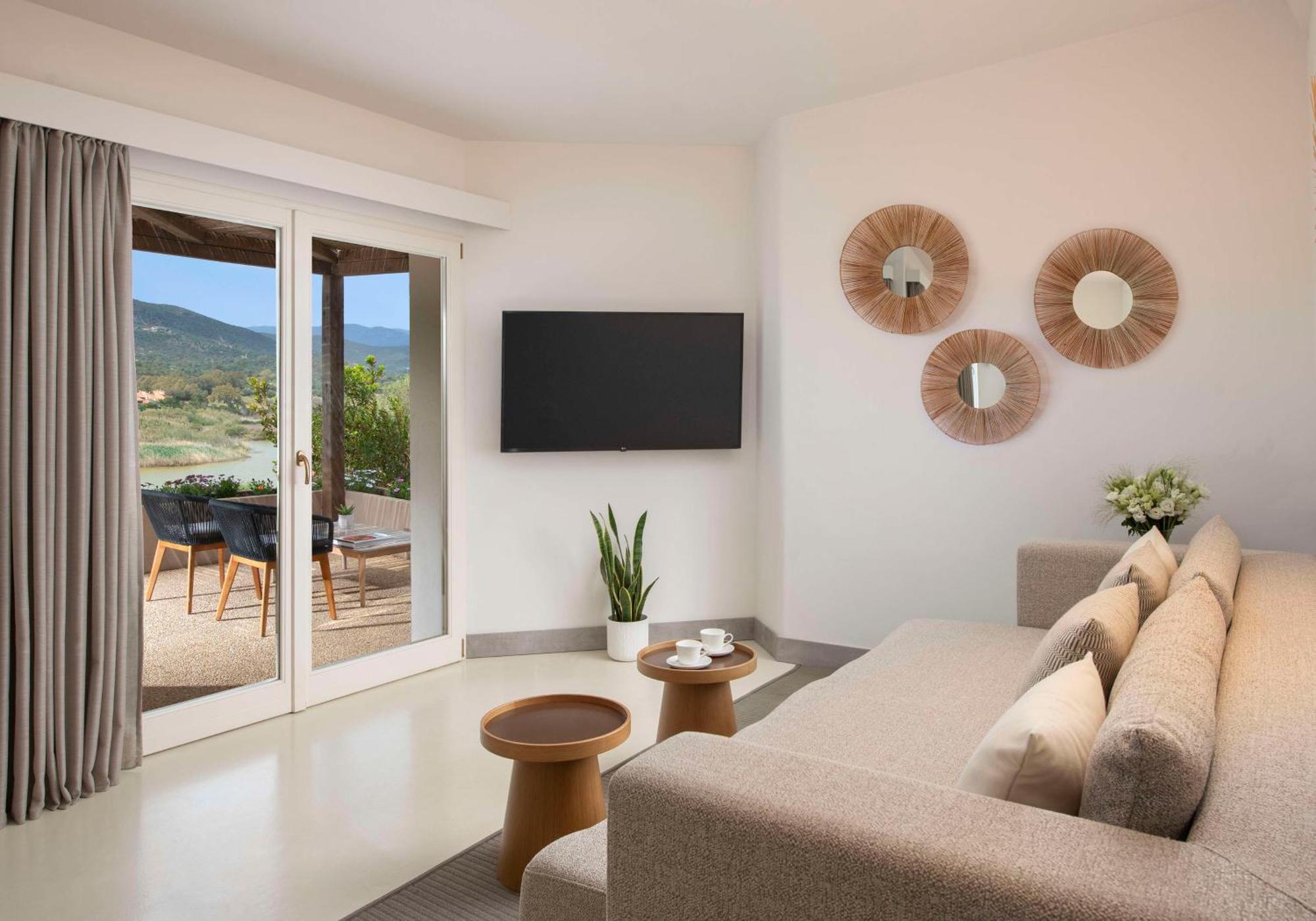 Baia Di Chia Resort Sardinia, Curio Collection By Hilton Exterior photo